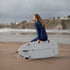 Gul Response 4/3mm Women's Wetsuit - Blue Paisley | Lifestyle Sitting on Surfboard