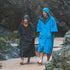 Gul EVORobe Hooded Changing Robe Blue & Black worn Strolling on the Beach