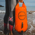 Zone3 Swim Buoy Dry Bag 28L | Orange on the beach