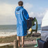 Gul EVORobe Hooded Changing Robe Blue | Worn by Surfer checking the conditions