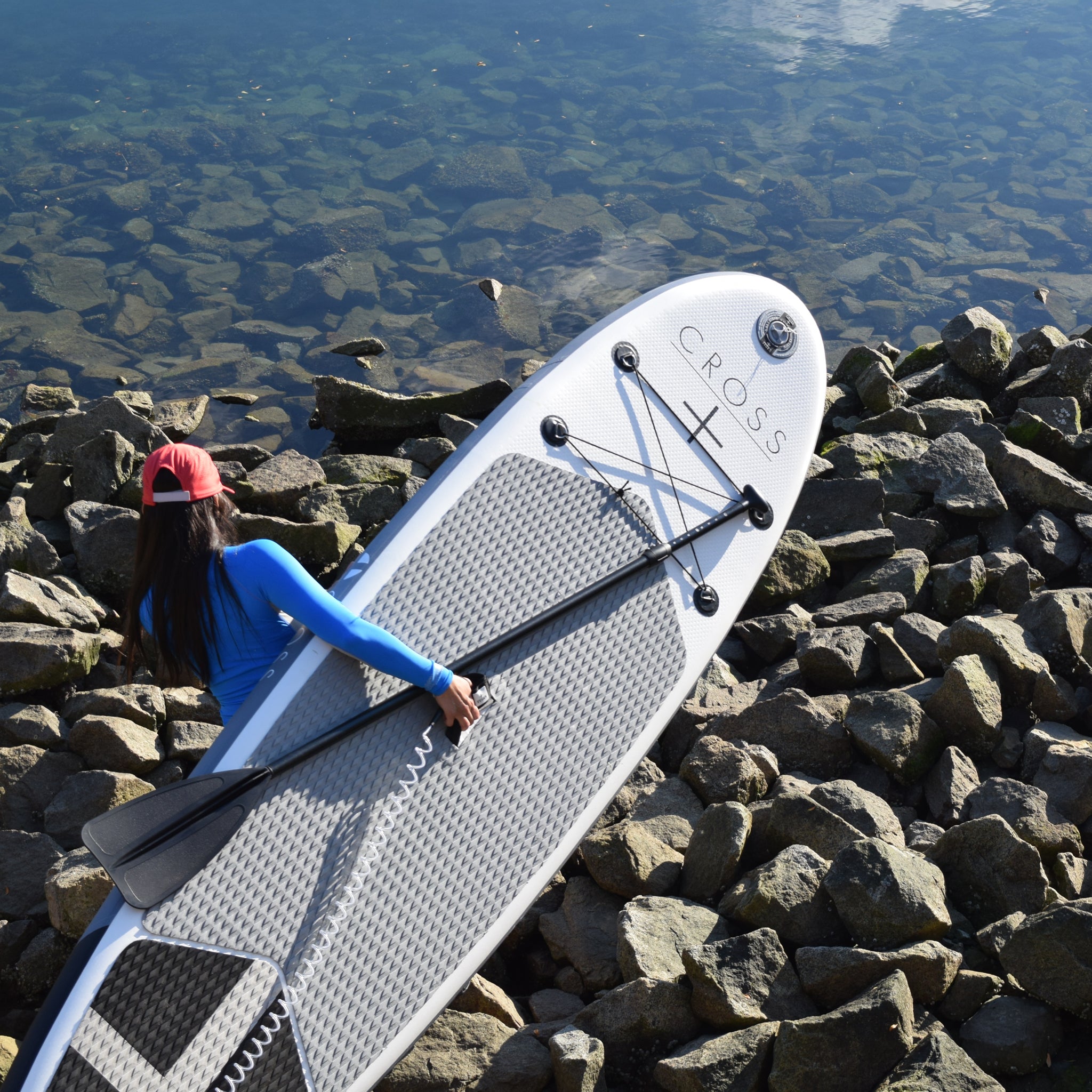 Gul 10' 7" CROSS Inflatable Paddle Board SUP and paddle being carried