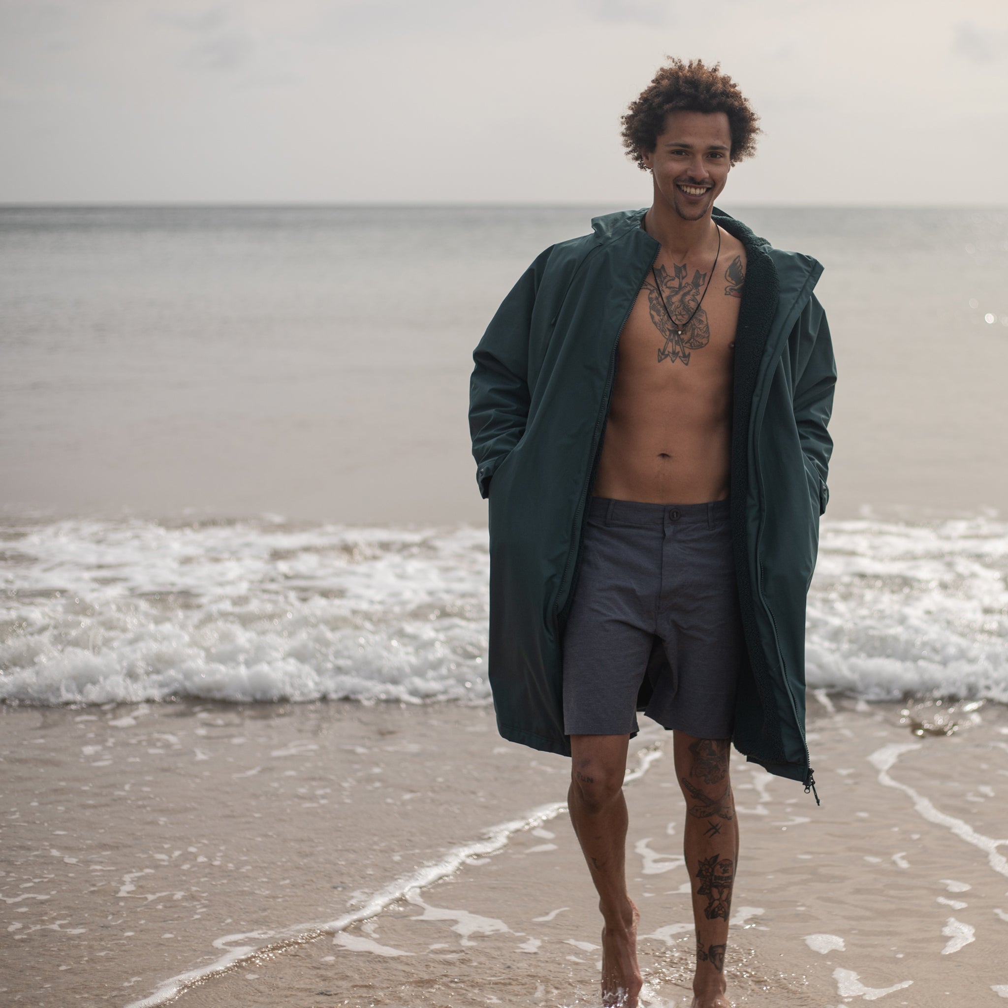 Fourth Element Tidal Change Robe made from Recycled Polyester - Green | On the beach